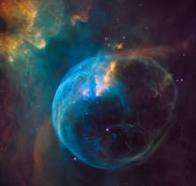 Cosmos and planet in space with blue and gold light_photo by NASA via Unsplash Creative Commons license