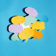 multiple colorful dialogue bubbles on blue surface via canva